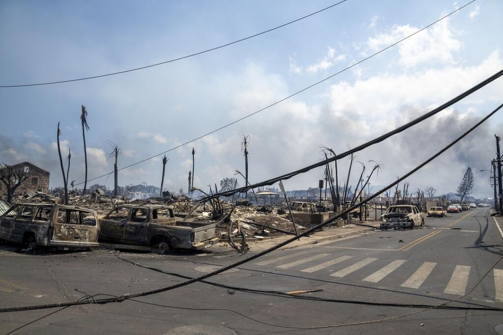 Wildfire wreckage is seen Wednesday, Aug. 9, 2023, in Lahaina, Hawaii. The scene at one of Maui's tourist hubs on Thursday looked like a wasteland, with homes and entire blocks reduced to ashes as firefighters as firefighters battled the deadliest blaze in the U.S. in recent years. (Tiffany Kidder Winn via AP)