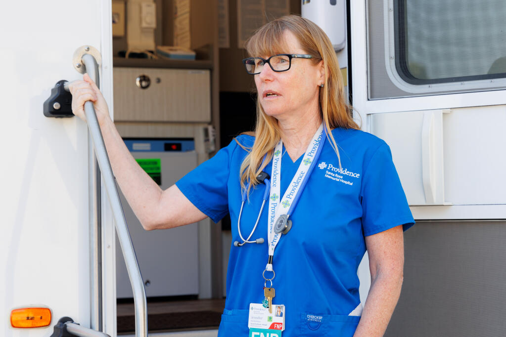 Jennifer Eid-Ammons stands at the entrance of the Providence Santa Rosa Memorial Hospital Mobile Health Clinic in the La Luz Center’s parking lot  on July 21, 2023. (Abraham Fuentes/ For the Index-Tribune)