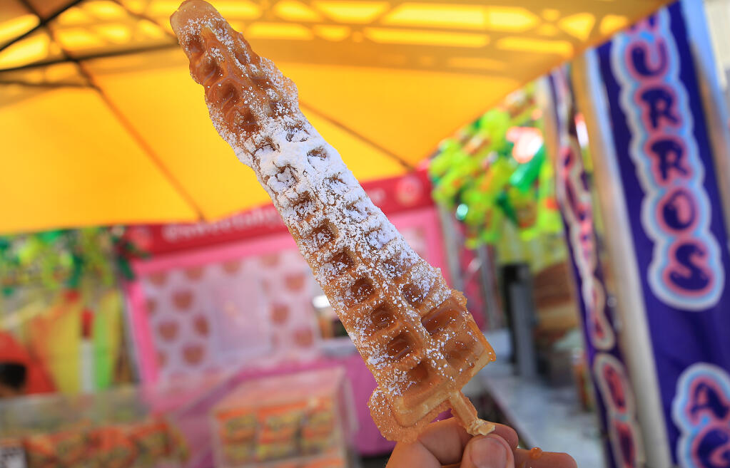 Waffle on a stick, during the first day of the Sonoma County Fair, Thursday, Aug. 4, 2022, at the Sonoma County Fairgrounds in Santa Rosa. (Kent Porter / The Press Democrat)