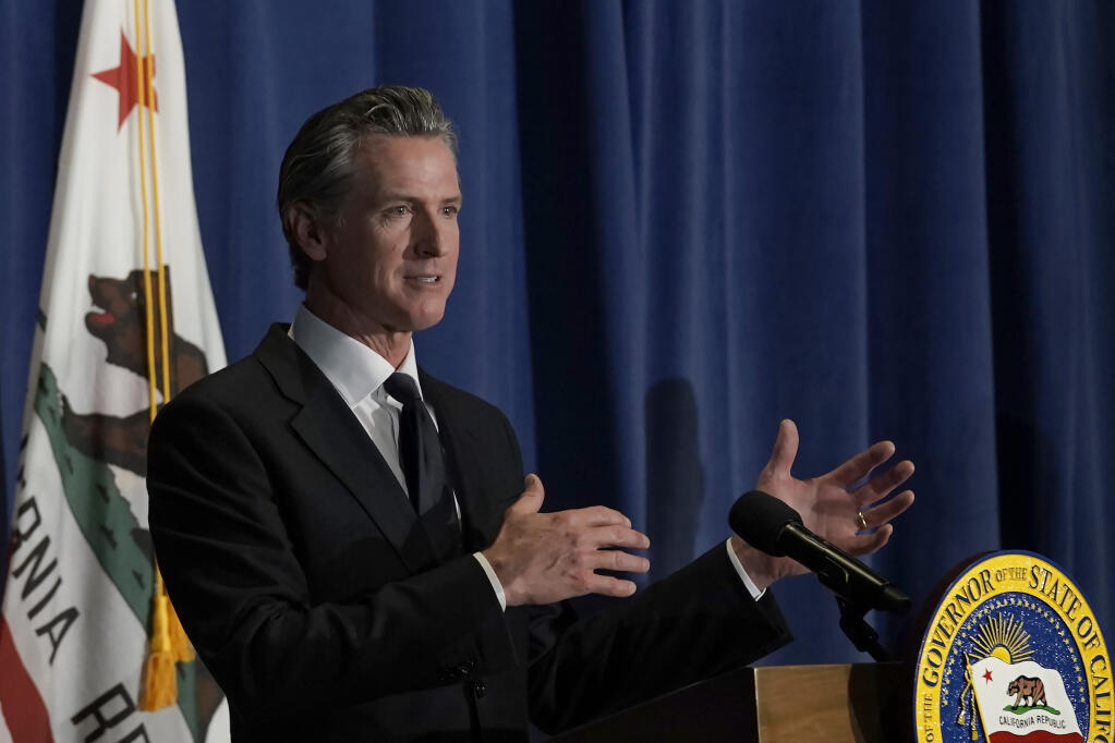 California Gov. Gavin Newsom outlines his 2022-2023 state budget revision during a news conference in Sacramento, Calif., Friday, May 13, 2022. (AP Photo/Rich Pedroncelli)