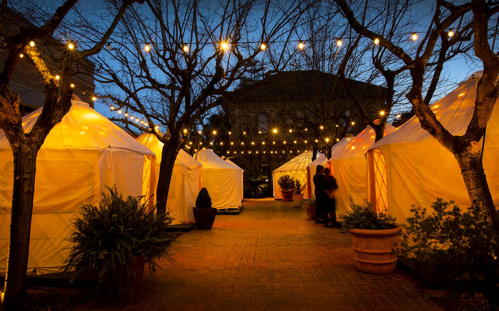 The courtyard at The Charter Oak Restaurant in St. Helena is transformed into a seasonal Yurt Village for cozy winter dining with a prix fixe menu on Friday, Jan. 28, 2022. (John Burgess/The Press Democrat)