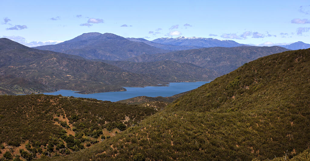 From Molok Luyuk, or Condor Ridge, Indian Valley Reservoir is nestled in the Berryessa Snow Mountain National Monument in Lake County, Thursday, May 2, 2024. Molok Luyuk is the latest addition to the monument. In the far background is Snow Mountain. (Kent Porter / The Press Democrat)