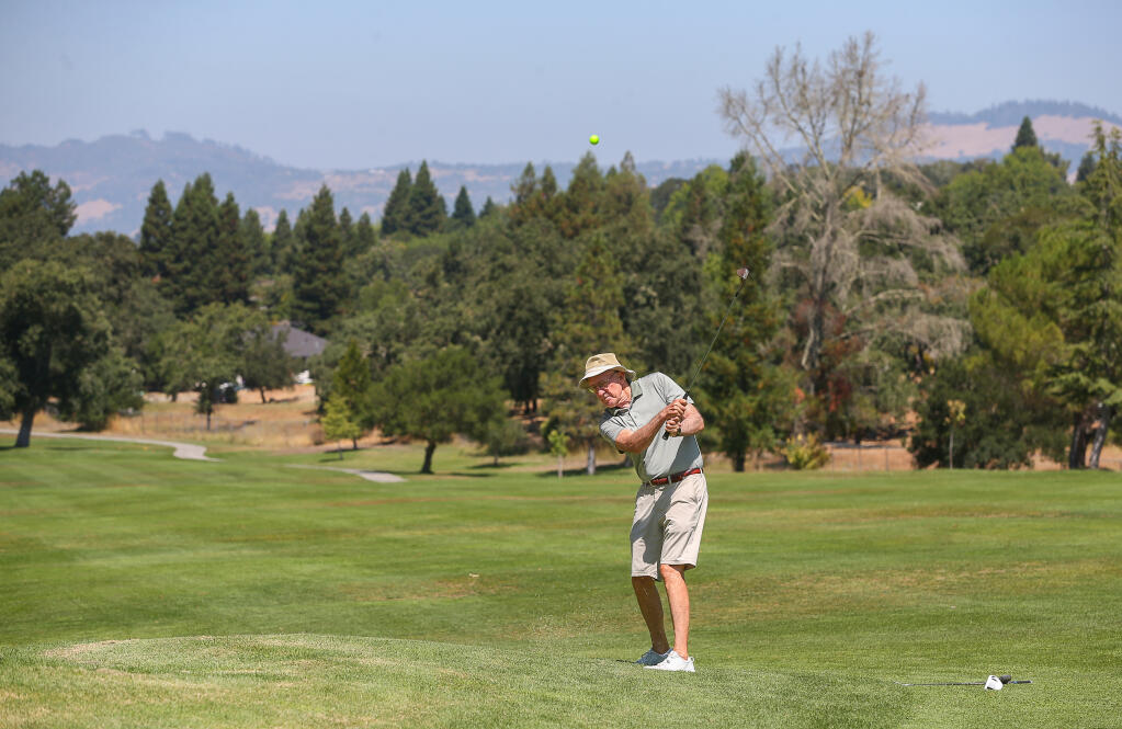 Ted Harris hits the ball on the 5th fairway of Bennett Valley Golf Course in Santa Rosa, Friday, Aug. 25, 2023. Harris has been golfing at Bennett Valley for 40 years. (Christopher Chung / The Press Democrat)