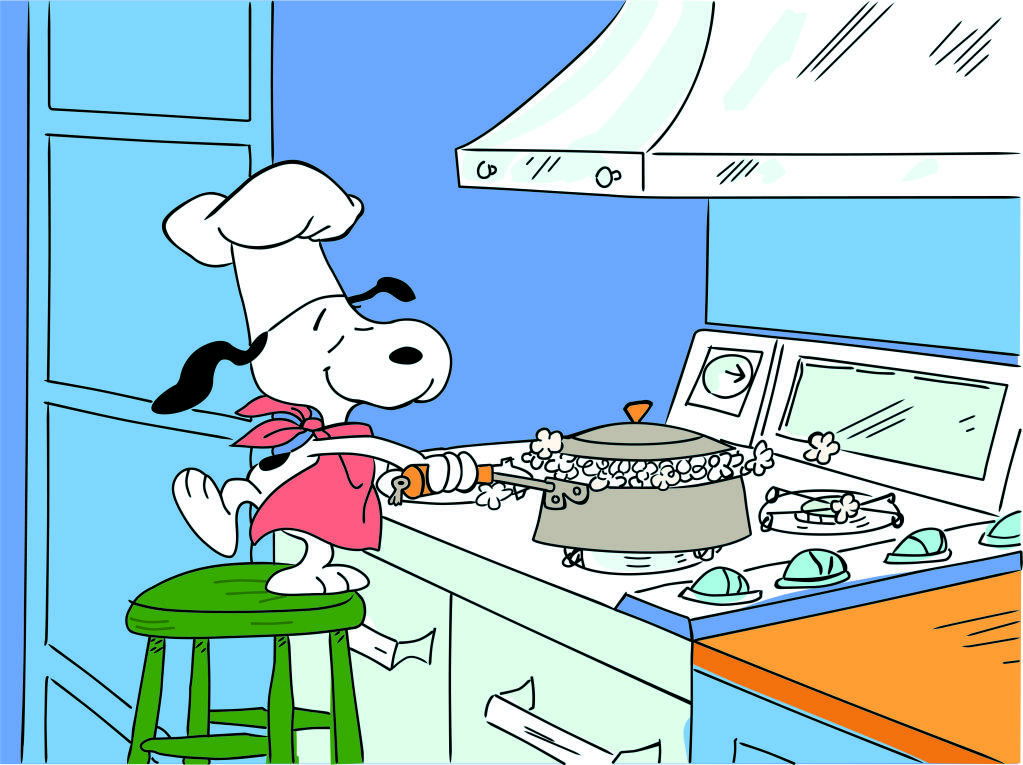 Snoopy prepares popcorn for a modest holiday feast in “A Charlie Brown Thanksgiving.” (Charles M. Schulz Museum)