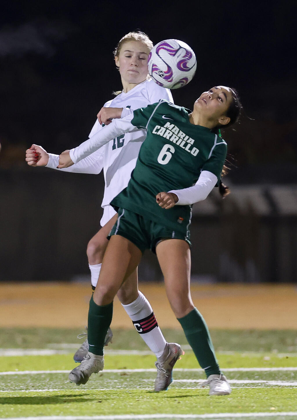 Maria Carrillo’s Kalli Cho, right, and Casa Grande’s Katie Curran go after the ball during their match in Santa Rosa on Thursday, Jan. 4, 2024.  (Christopher Chung/The Press Democrat)
