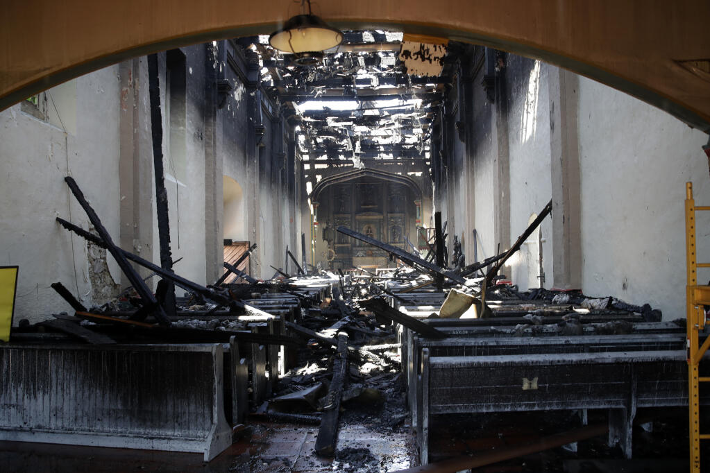 The interior of the San Gabriel Mission Saturday, July 11, 2020, is seen in the aftermath of a morning fire in San Gabriel, Calif. The fire destroyed the rooftop and most of the interior of the nearly 250-year-old California church that was undergoing renovation. (AP Photo/Marcio Jose Sanchez)