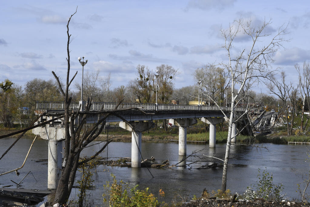 A view of a destroyed bridge across Siverskyi-Donets river in the liberated town of Sviatohirsk, Donetsk region, Ukraine, Saturday, Oct. 29, 2022. (AP Photo/Andriy Andriyenko)