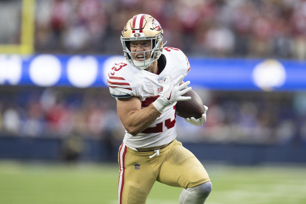 49ers running back Christian McCaffrey runs with the ball Oct. 30 against the Los Angeles Rams. (Kyusung Gong / ASSOCIATED PRESS)