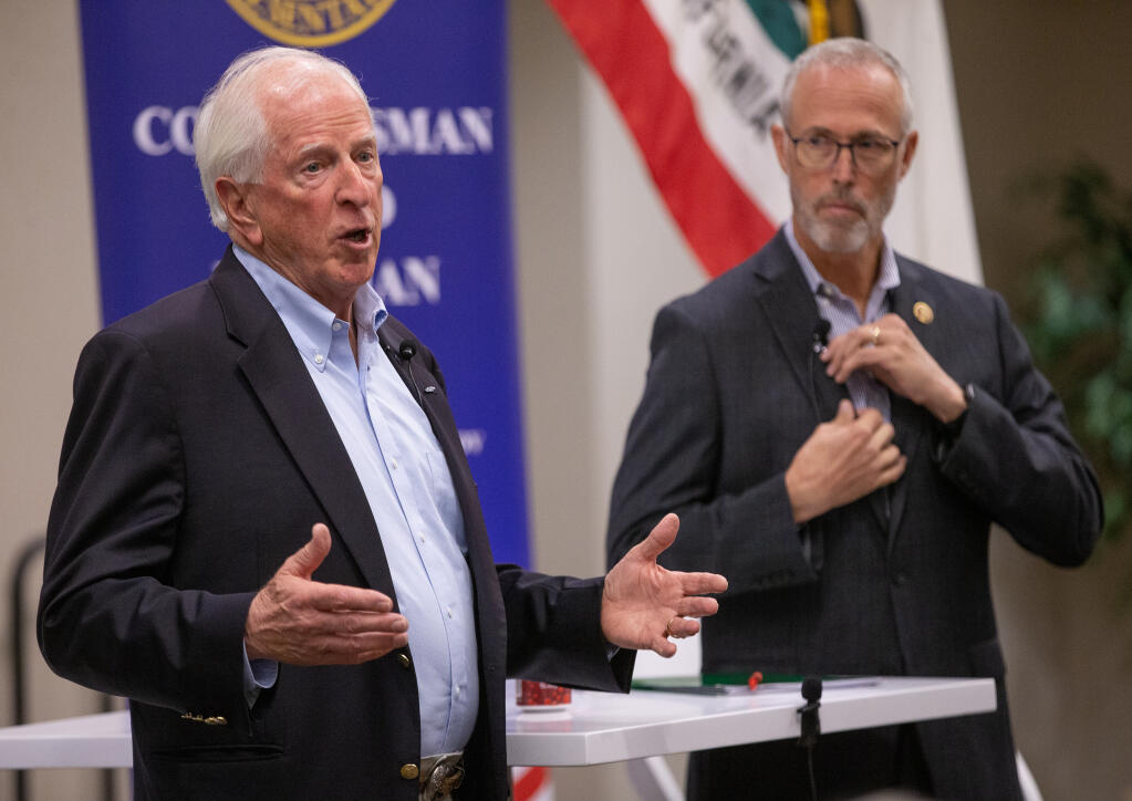 Representatives Mike Thompson, left, (D-St. Helena) and Jared Huffman (D-San Rafael) open their town meeting in Santa Rosa with an update on their work in Congress and then took questions from participants on subjects from gun control to federal assistance to fishermen April 12, 2023. (Chad Surmick / The Press Democrat)