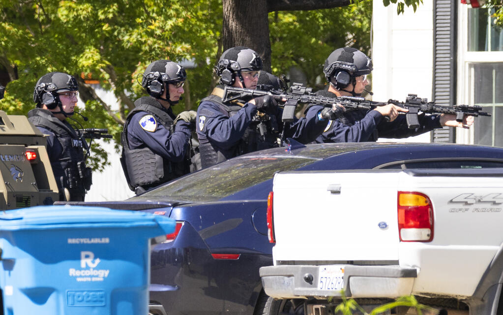 The Santa Rosa police department SWAT team moves in to enter a Humboldt Street home on Wednesday afternoon, May 4, 2022, in search of a suspect, who was not home at the time. (John Burgess/The Press Democrat)