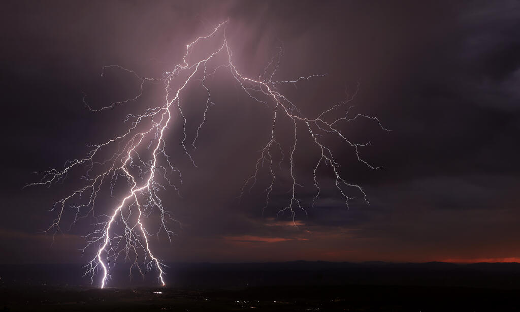 Lightning strikes the Alexander Valley, Sunday, July 16, 2023.  As the high-pressure ridge breaks down, monsoonal moisture has moved in sparking dry lightning in Northern California.   (Kent Porter / The Press Democrat)