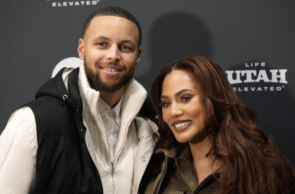 Golden State Warriors NBA basketball player Stephen Curry, the subject of the documentary film "Stephen Curry: Underrated," poses with his wife Ayesha at the premiere of the film at the 2023 Sundance Film Festival, Monday, Jan. 23, 2023, in Park City, Utah. (AP Photo/Chris Pizzello)