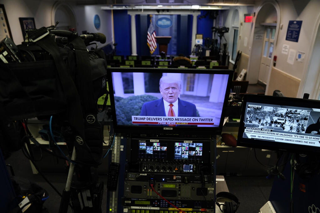 FILE - In a pre-recorded video message, President Donald Trump delivers a statement after rioters stormed the Capitol building during the electoral college certification of Joe Biden as President, Jan. 6, 2021, in Washington. Former President Donald Trump repeatedly declined in an interview aired Sunday to answer questions about whether he watched the Capitol riot unfold on television, saying he would “tell people later at an appropriate time.” (AP Photo/Evan Vucci, File)