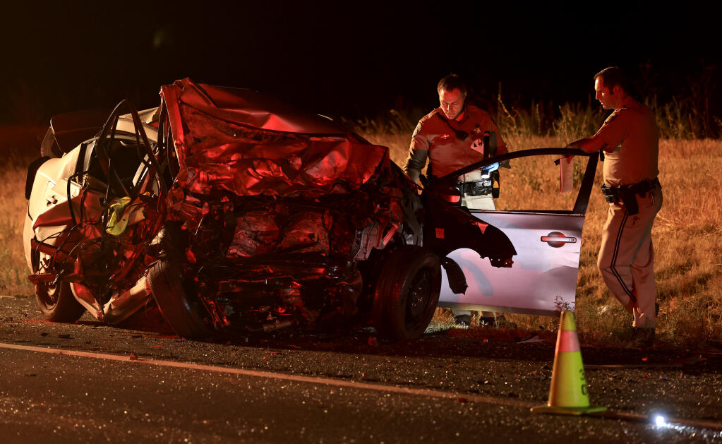 California Highway Patrol personnel investigate the scene of a fatal accident on Highway 101 in Geyserville, Thursday, July 13, 2023. (Kent Porter / The Press Democrat)