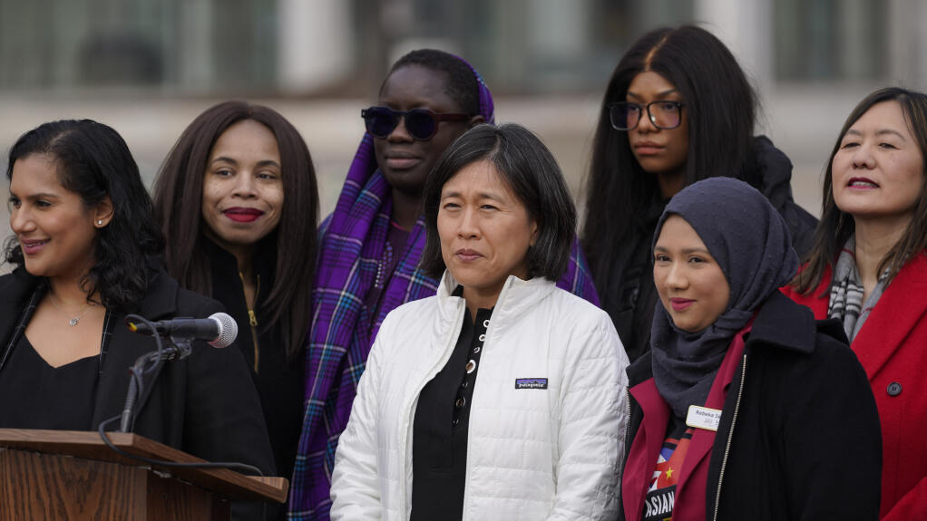 United States Trade Representative Katherine Tai, center, attends a "Break The Silence – Justice for Asian Women" rally in Detroit, Wednesday, March 16, 2022. Asian American organizations in cities across the country planned rallies Wednesday to mark the anniversary of the fatal shooting at three massage businesses, in Acworth, Ga. and to promote awareness about ongoing violence against Asian Americans and Pacific Islanders. (AP Photo/Paul Sancya)