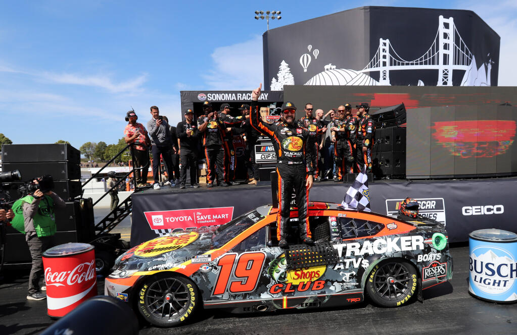 Martin Truex Jr (19) of Bass Pro Shops Toyota, celebrates in victory lane after winning the Toyota/Save Mart 350 NASCAR Cup Series auto race at Sonoma Raceway, Sunday, June 11, 2023 in Sonoma. (Darryl Bush / For The Press Democrat)