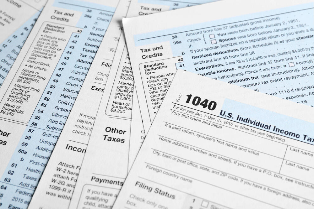 Individual Tax Return Forms on table