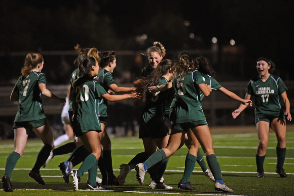Maria Carrillo teammates celebrate after scoring in their first game against Windsor High back on Jan. 14. In Tuesday’s rematch, the Pumas triumphed to hand the Jaguars their first loss. (Erik Castro/for The Press Democrat)