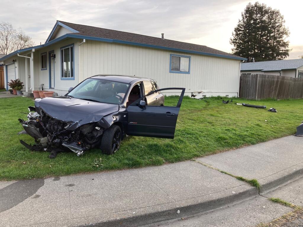 The driver of this car crashed into a Petaluma home Wednesday, March 2, 2022, Petaluma police said. Officers identified the driver as a 17-year-old without a license to drive. (Petaluma Police Department)