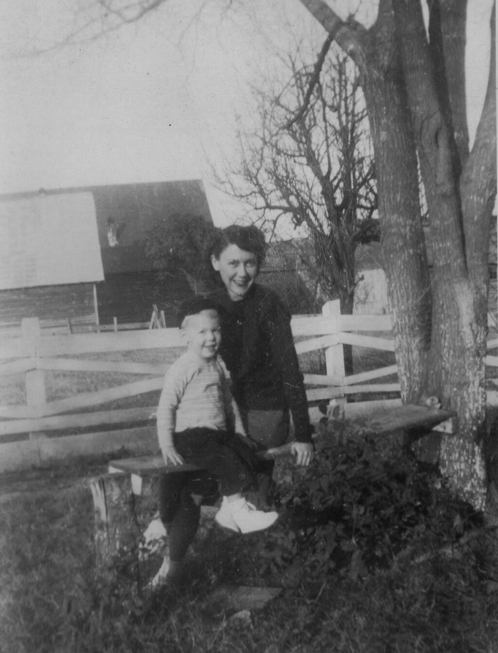 In this image provided by the McConnell Center at the University of Louisville, Mitch McConnell sits with his mother Julia 'Dean' McConnell on a bench in this image from the mid 1940's in Five Points, Ala.. As the coronavirus pandemic unfolds, Senate Majority Leader Mitch McConnell flashes back to an earlier crisis that gripped the nation, and his own life, when he was a boy. He was struck with polio. (McConnell Center at the University of Louisville via AP)