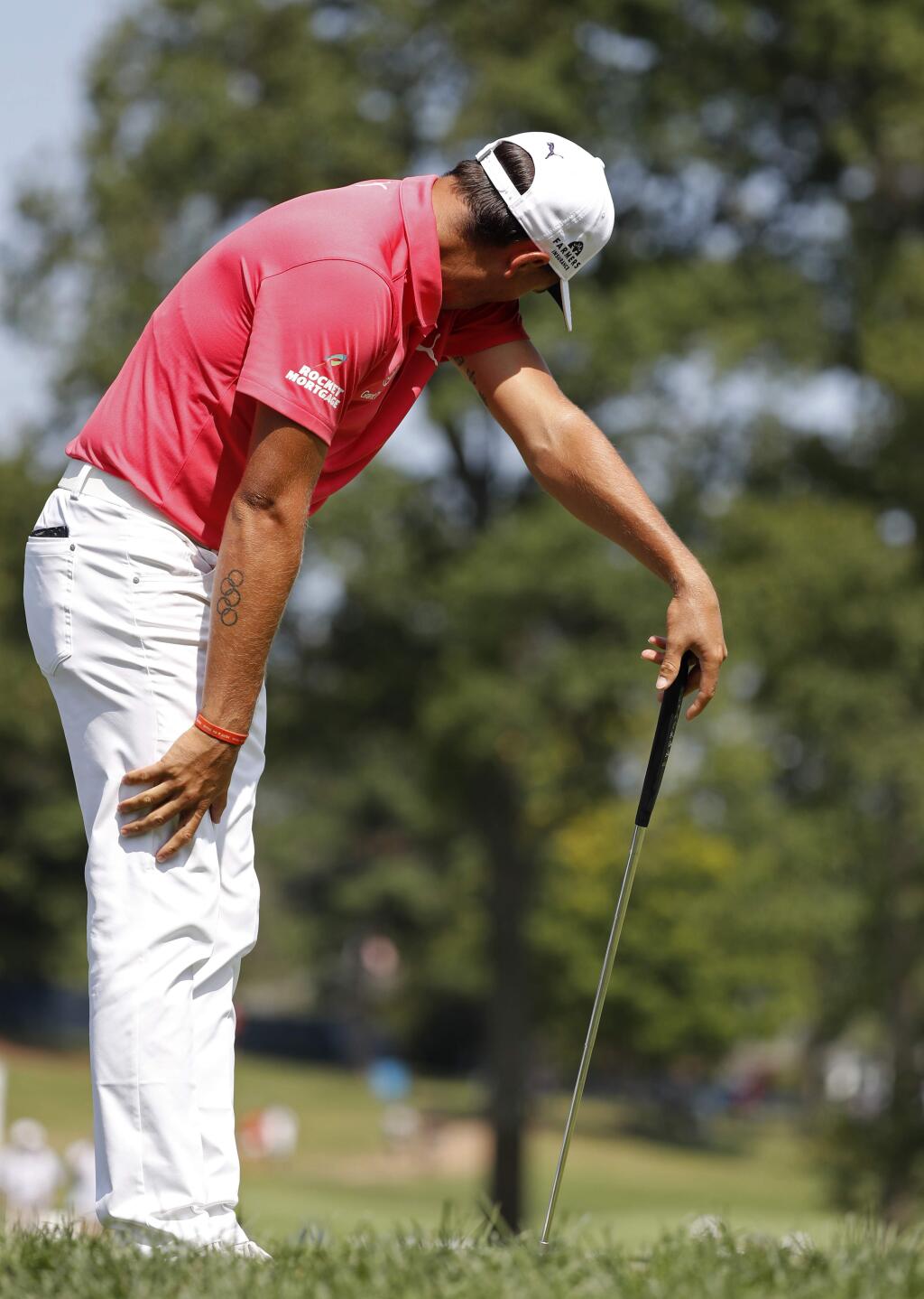 Rickie Fowler reacts to a missed putt on the seventh hole during the third round of the PGA Championship golf tournament at Bellerive Country Club, Saturday, Aug. 11, 2018, in St. Louis. (AP Photo/Brynn Anderson)