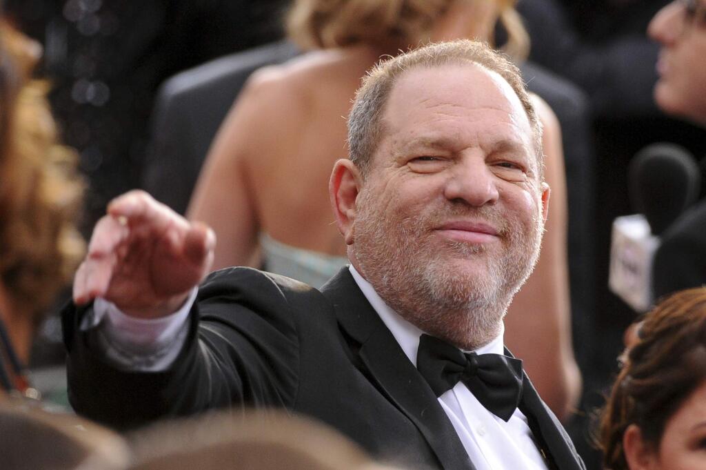 FILE- In this Feb. 22, 2015 file photo, Harvey Weinstein arrives at the Oscars at the Dolby Theatre in Los Angeles. On Saturday, Oct. 14, 2016, the Academy of Motion Picture Arts and Sciences revoked Weinstein's membership. The decision, reached Saturday in an emergency session, comes in the wake of recent reports by The New York Times and The New Yorker magazine that revealed sexual harassment and rape allegations against him going back decades.(Photo by Vince Bucci/Invision/AP, File)