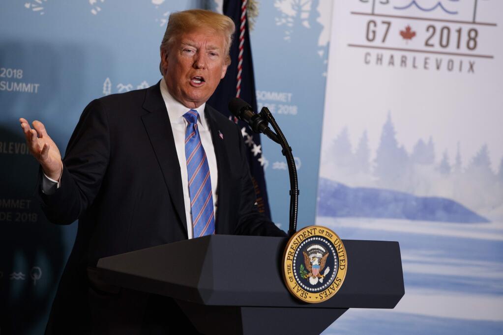 FILE - In this June 9, 2018 file photo, President Donald Trump speaks during a news conference at the G-7 summit in La Malbaie, Quebec, Canada. New York Attorney General sues the Trump Foundation, Thursday, June 14, saying it engaged in a pattern of illegal self-dealing. (AP Photo/Evan Vucci, File)