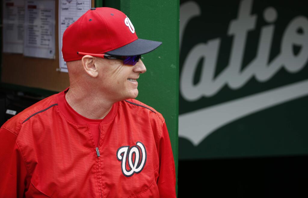 Washington Nationals manager Matt Williams smiles in the dugout before a game against the Cincinnati Reds at Nationals Park, Monday, Sept. 28, 2015, in Washington. (AP Photo/Alex Brandon)