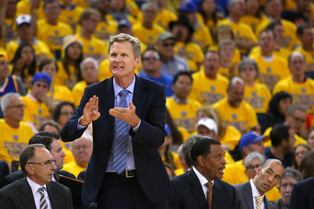 Golden State Warriors head coach Steve Kerr tries to correct an referee's call during Game 1 of the first round of the Western Conference playoffs at Oracle Arena on Saturday, April 18, 2015. (Christopher Chung / The Press Democrat)