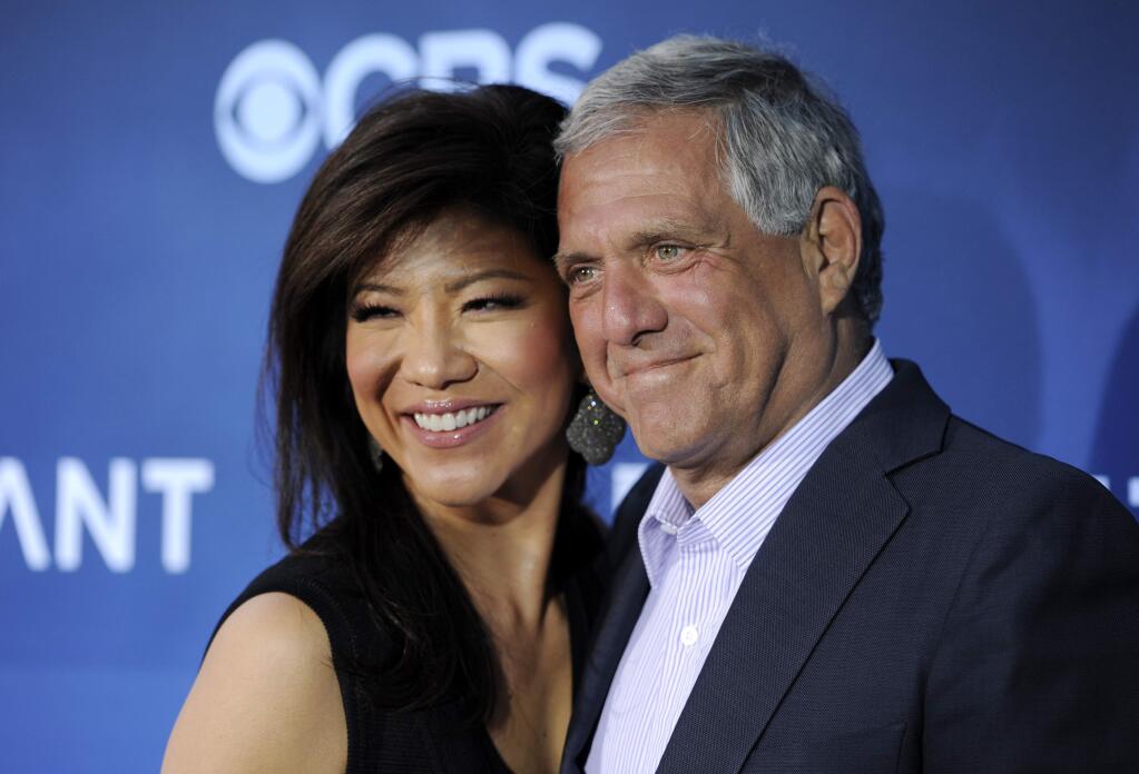 FILE - In this June 16, 2014 file photo, Les Moonves, right, president and CEO of CBS Corporation, and his wife Julie Chen pose together at the premiere of the CBS science fiction television series 'Extant' in Los Angeles. Chen returned to television with an unusual sign-off days after her husband, Les Moonves, resigned as CBS CEO following sexual misconduct allegations. The 48-year-old ended Thursday, Sept. 13, 2018 ‚ÄúBig Brother‚Äù broadcast by saying, ‚ÄúFrom outside the ‚ÄòBig Brother‚Äô house, I‚Äôm Julie Chen Moonves. Good night.‚Äù Usually, she just says ‚ÄúJulie Chen.‚Äù (Photo by Chris Pizzello/Invision/AP, File)