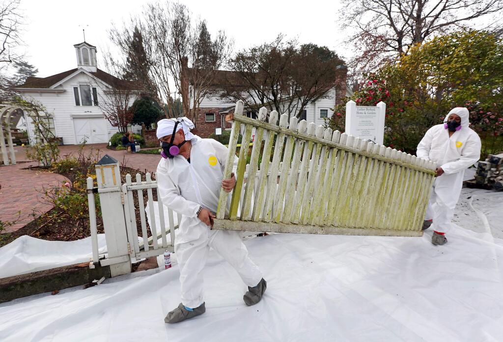 Workers removed the old rotted picket fence surrounding the Luther Burbank Home & Gardens in Santa Rosa on Tuesday, January 20, 2015. (photo by John Burgess/The Press Democrat)