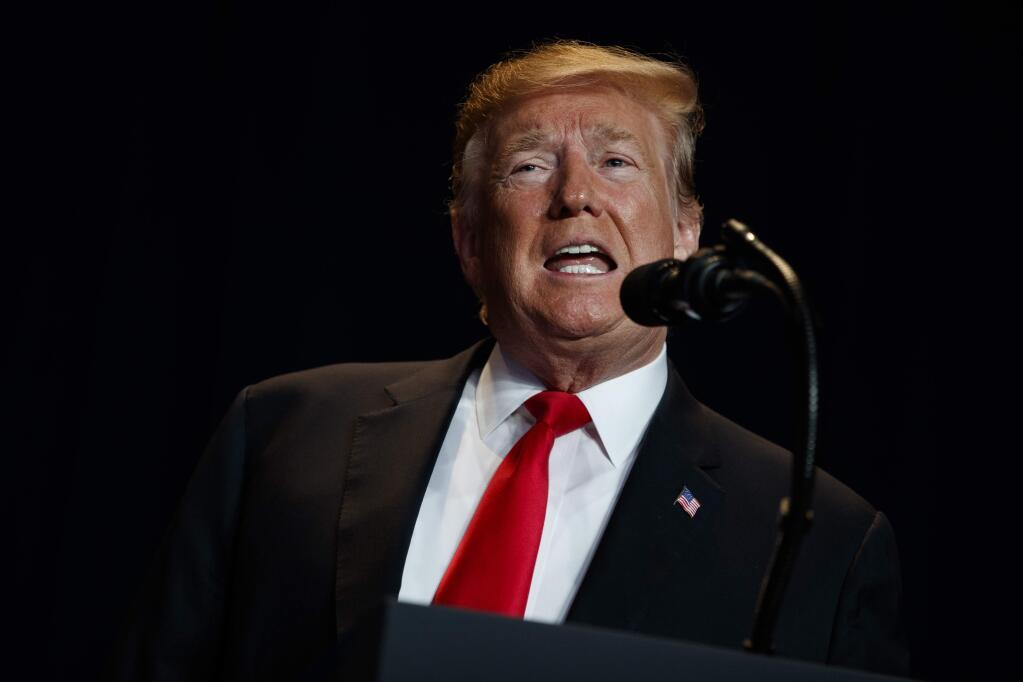 In this Feb. 7, 2019 photo, President Donald Trump speaks during the National Prayer Breakfast, in Washington. Trump is trying to turn the debate over a wall at the U.S.-Mexico border back to his political advantage as his signature pledge to American voters threatens to become a model of unfulfilled promises. Trump will hold his first campaign rally since November's midterm elections in El Paso, Texas, on Monday. (AP Photo/ Evan Vucci)