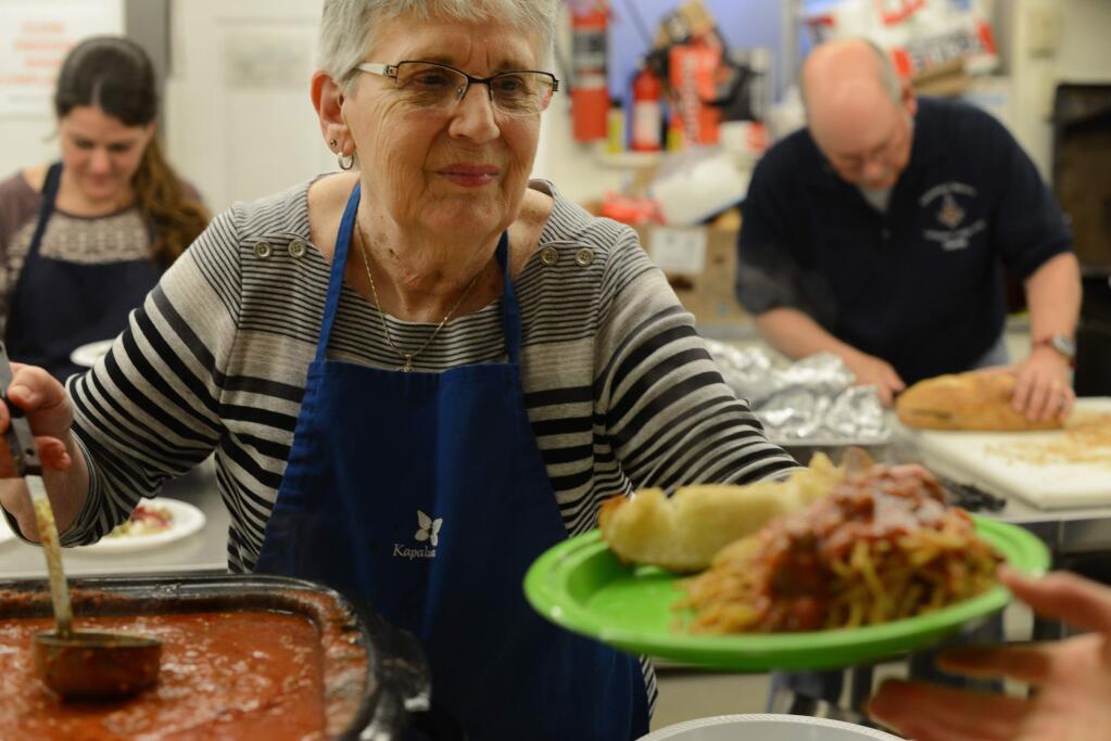 Kitty Frisbie serving up platefuls of spaghetti during the Pasta and Music Night Spaghetti Dinner Fundraiser held Saturday at the Masonic Lodge in Sebastopol, California. Proceeds benefit the Analy Band Wagon and the instrumental music program at Analy High School. February 24, 2018. (Photo: Erik Castro/for The Press Democrat)