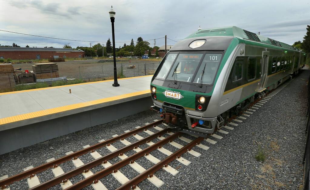Passenger trains will begin rolling through the Railroad Square station in Santa Rosa by the end of the year, but plans for a live/work development on the lot west of the station. upper left, remain unfulfilled . (JOHN BURGESS/The Press Democrat)