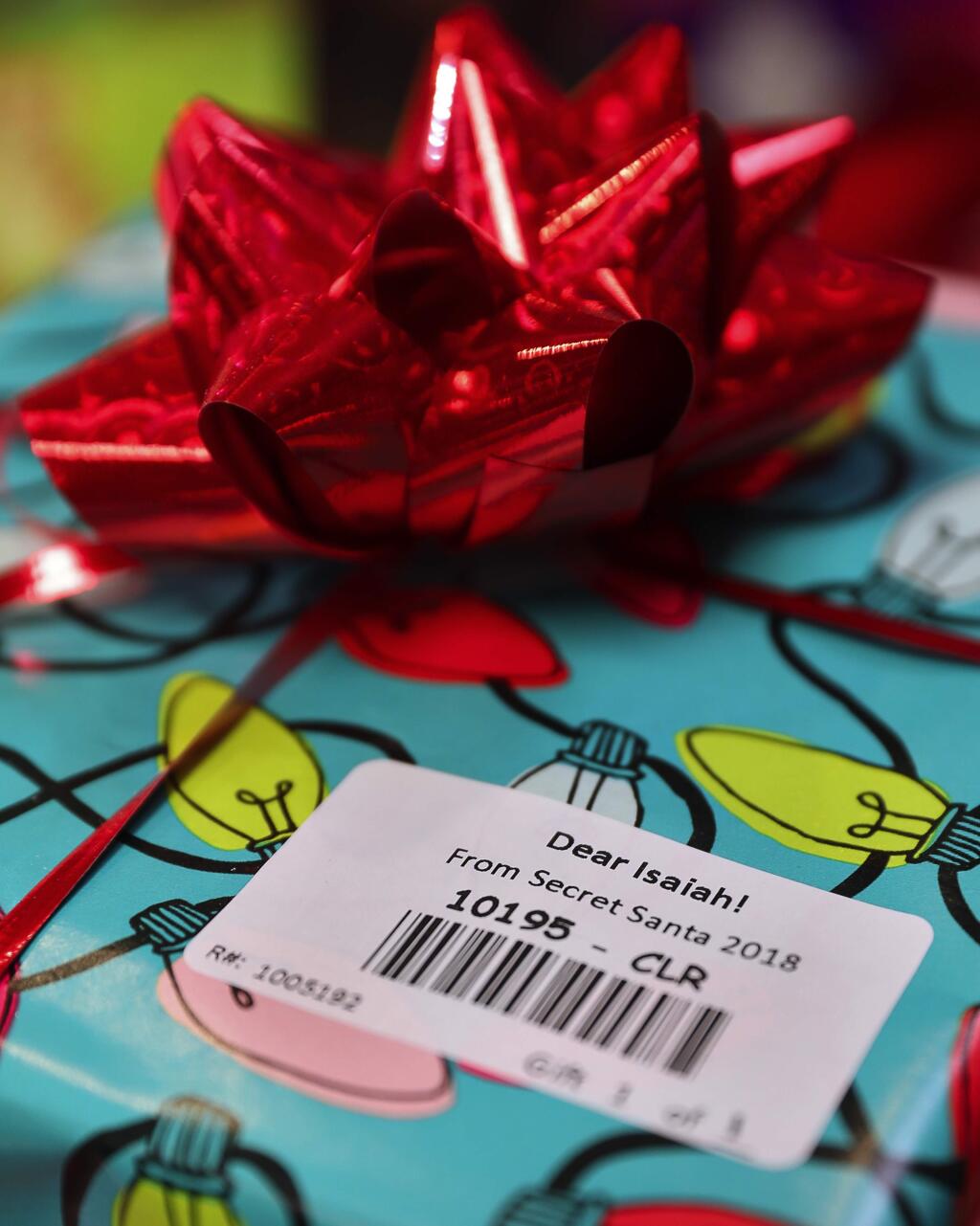 Heart wishes and Secret Santa gifts are now barcoded as part of the new digital-friendly ways for people to donate. (Christopher Chung/ The Press Democrat)