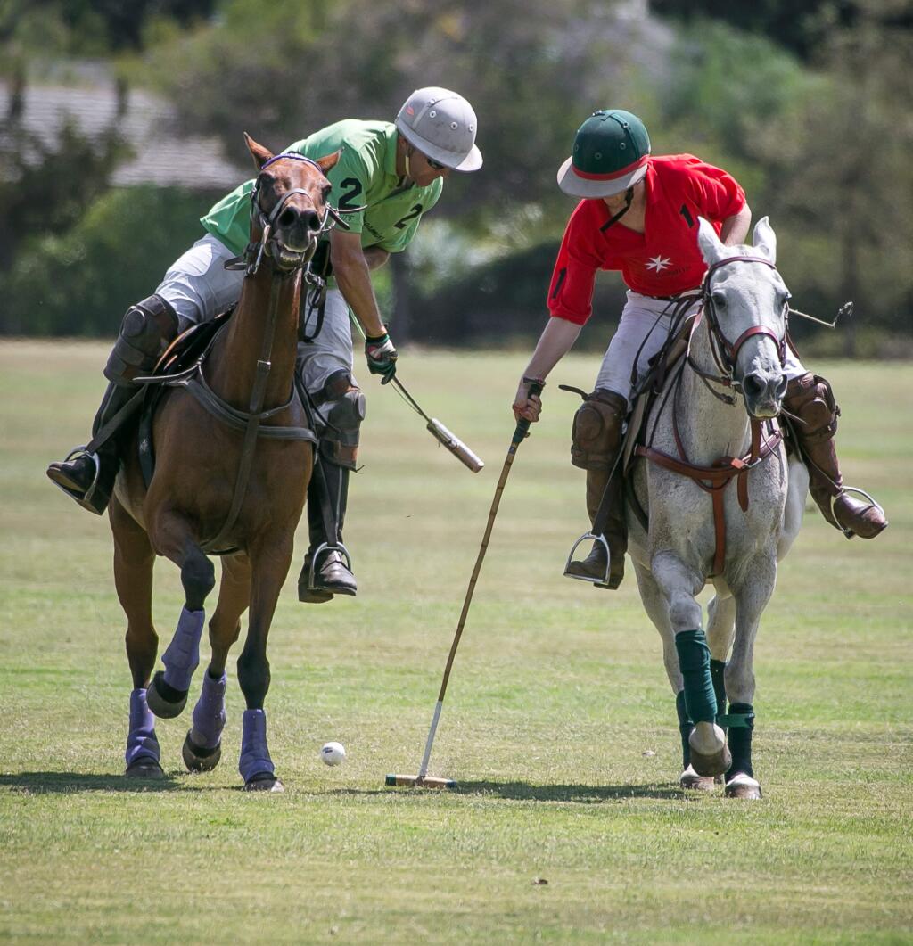 California Dreaming's Mark Urdhal, left, and The Knights' Hunter Schuafel battle for possession of the ball during the 2015 Wounded Veterans Polo Benefit hosted by the Wine Country Polo Club in Santa Rosa, Calif. Sunday, August 30, 2015.
