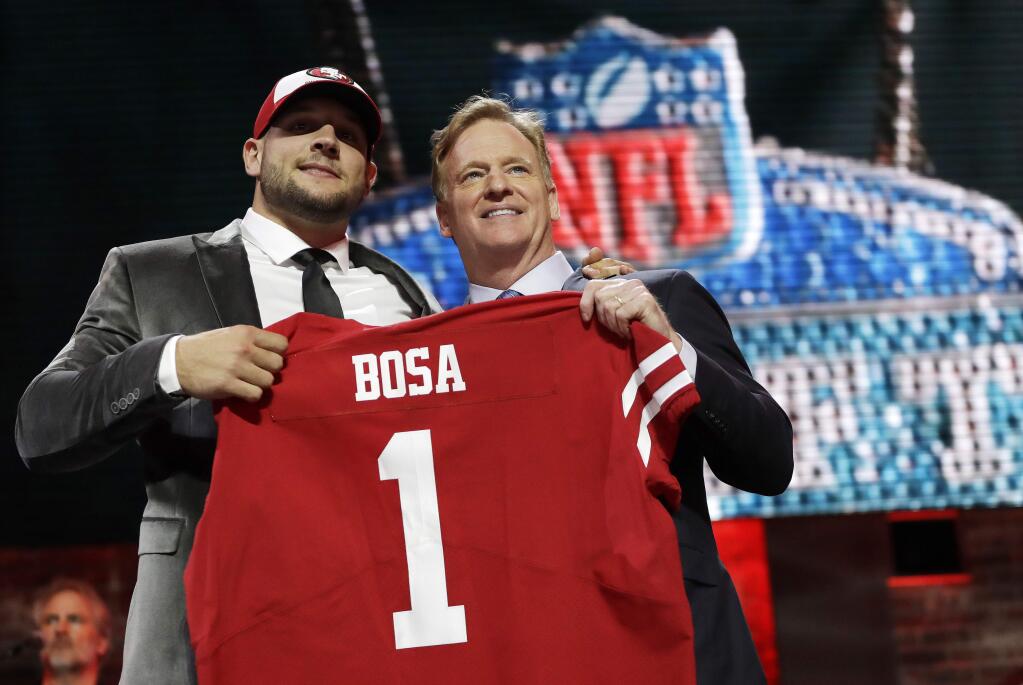 Ohio State defensive end Nick Bosa poses with NFL Commissioner Roger Goodell after the San Francisco 49ers selected Bosa in the first round at the NFL draft, Thursday, April 25, 2019, in Nashville, Tenn. (AP Photo/Mark Humphrey)