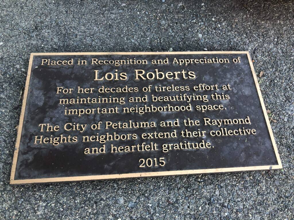 Lois Roberts still doesn't know who among her neighbors spearheaded the effort to have this plaque placed in her honor at the West end of 'Raymond Heights Park.'(PHOTOS BY DAVID TEMPLETON)