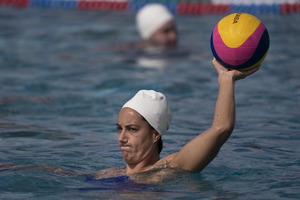 In this April 27, 2021, file photo, Maggie Steffens, a member of the U.S. women’s water polo team, trains at MWR Aquatic Training Center in Los Alamitos. The Tokyo Games have 18 new events this year and will be the first with nearly equal gender participation. (Jae C. Hong / ASSOCIATED PRESS)