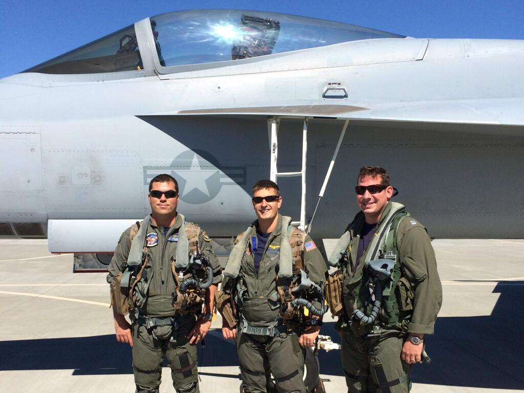 One of the Navy F/A-18 Super Hornets that will perform at this weekend's Pacific Coast Air Museum's Wings Over Wine County Airshow and, from the left, lieutenants Jayson Trembath, Brett Jakovich and Noland Lucas of Naval Air Station Lemoore. (DOUG CLAY photo)
