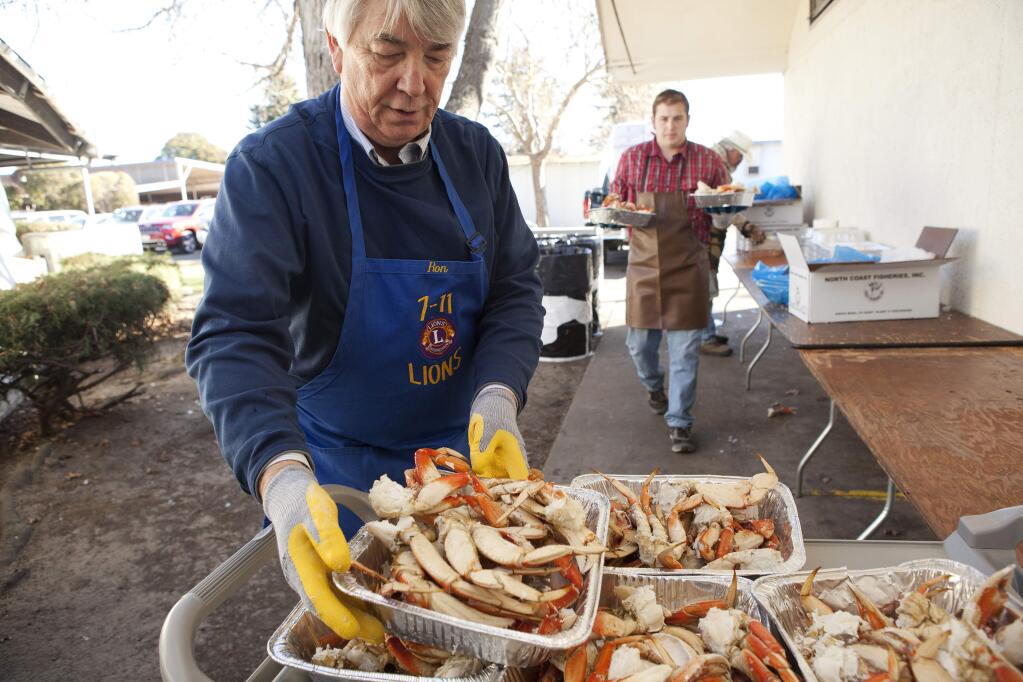 Ron Hammer, chairman of the Petaluma 7-11 Lions 32nd Annual Crab Feed, loads fresh crab on to a serving tray outside Herzog Hall In Petaluma.Shot on Saturday January 18, 2014 at Herzog Hall in Petaluma, Calif. for the Press Democrat. ( Photo by Charlie Gesell )