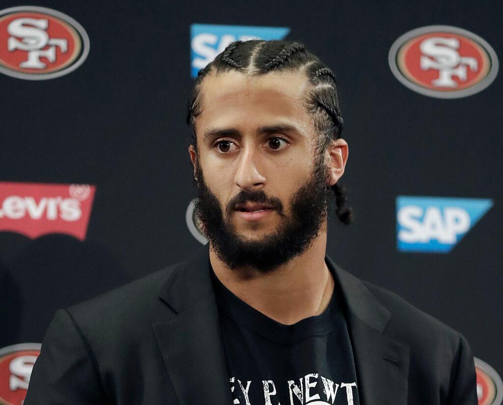 This Jan. 1, 2017, file photo shows then-49ers quarterback Colin Kaepernick speaking at a news conference after the team's game against the Seattle Seahawks in Santa Clara. (AP Photo/Marcio Jose Sanchez, File)