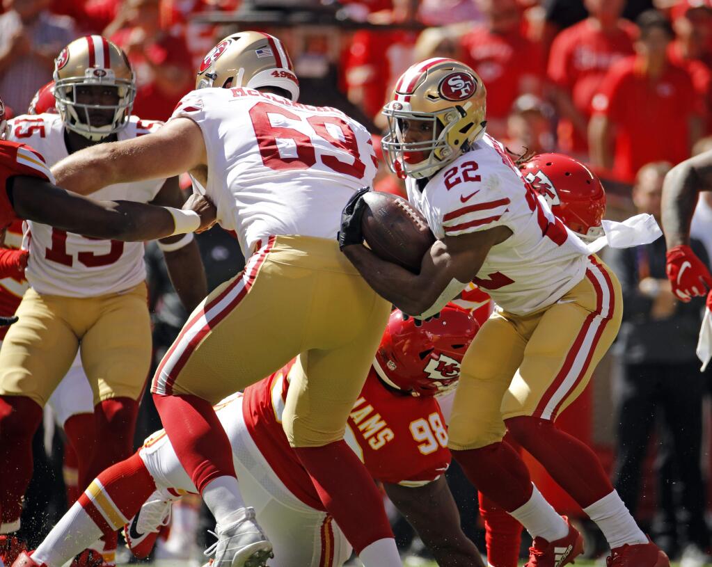 San Francisco 49ers running back Matt Breida, right, runs behind offensive tackle Mike McGlinchey during the first half against the Kansas City Chiefs in Kansas City, Mo., Sunday, Sept. 23, 2018. (AP Photo/Charlie Riedel)