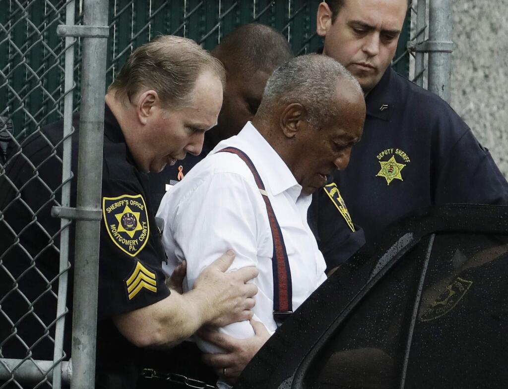 Bill Cosby departs after his sentencing hearing at the Montgomery County Courthouse, Tuesday, Sept. 25, 2018, in Norristown, Pa. Cosby left in handcuffs to begin serving a three-to-10 year prison sentence for sexual assault. (AP Photo/Matt Slocum)