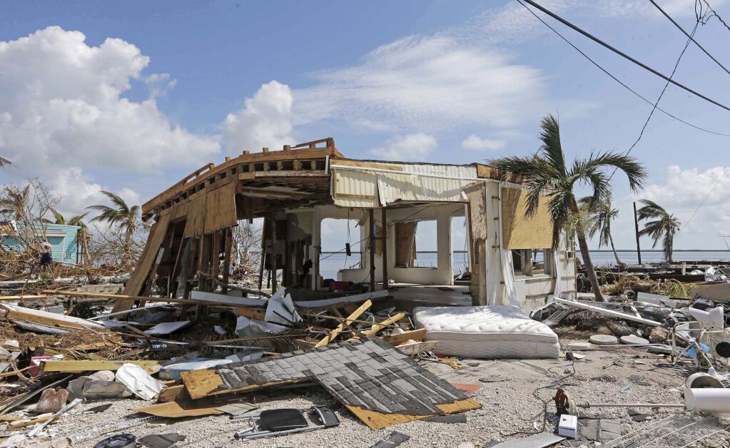Debris surrounds a destroyed structure in the aftermath of Hurricane Irma, Wednesday, Sept. 13, 2017, in Big Pine Key, Fla. (AP Photo/Alan Diaz)