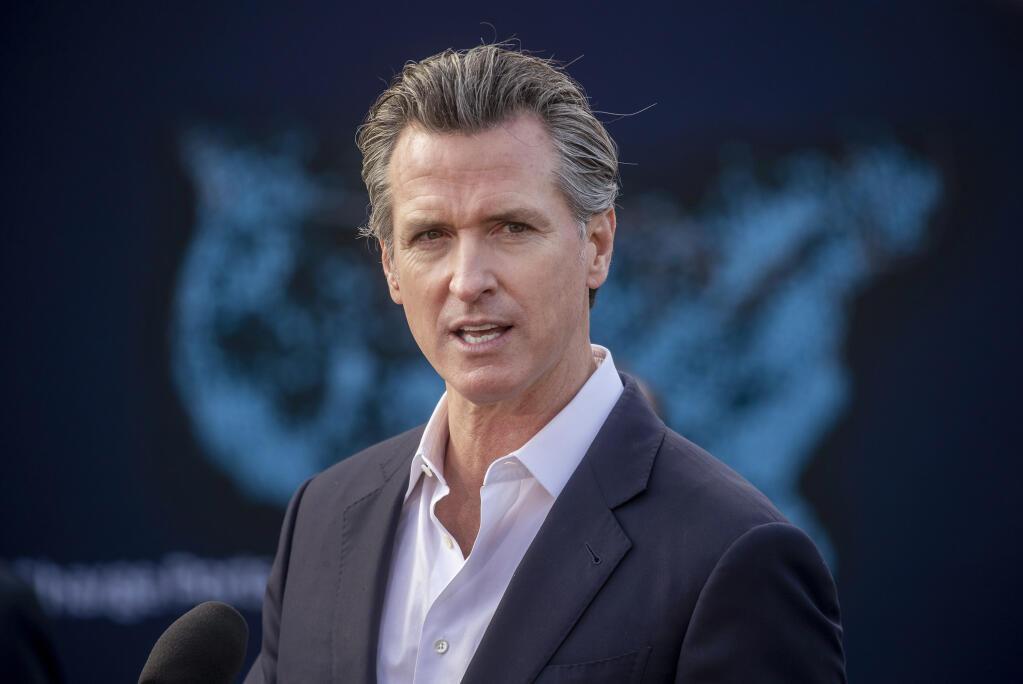 FILE - California Gov. Gavin Newsom visits Ford Greenfield Labs in Palo Alto, Calif., Wednesday, Jan. 26, 2022, to highlight his proposed budget that includes billions of dollars to accelerate the state's zero-emission vehicle (ZEV) goals. (Karl Mondon/Bay Area News Group via AP, File)