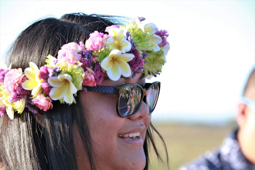 Nikkole Suka wearing a fresh floral wreath and sunglasses at Becoming Independent's 4th Annual Luau at Becoming Independent in Santa Rosa, Saturday, Sept. 23, 2017. (Will Bucquoy / For the Press Democrat)
