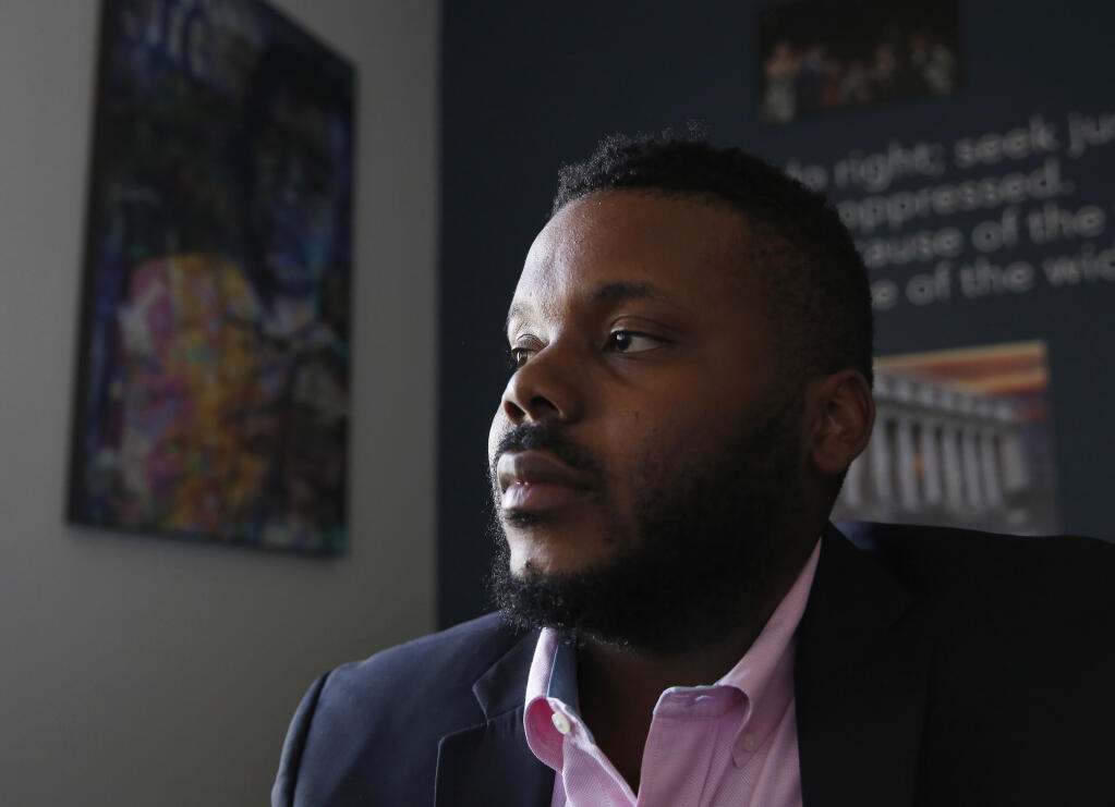 FILE - In this Aug. 14, 2019, file photo, Stockton Mayor Michael Tubbs talks during an interview in Stockton, Calif.  Tubbs is one of the youngest mayors in the country and was the city’s first Black mayor. He garnered national attention with his universal basic income program that fights poverty by paying people $500 a month. But despite winning 70% of the vote, Tubbs is trailing a Republican challenger, putting him in danger of losing his seat.   (AP Photo/Rich Pedroncelli, File)