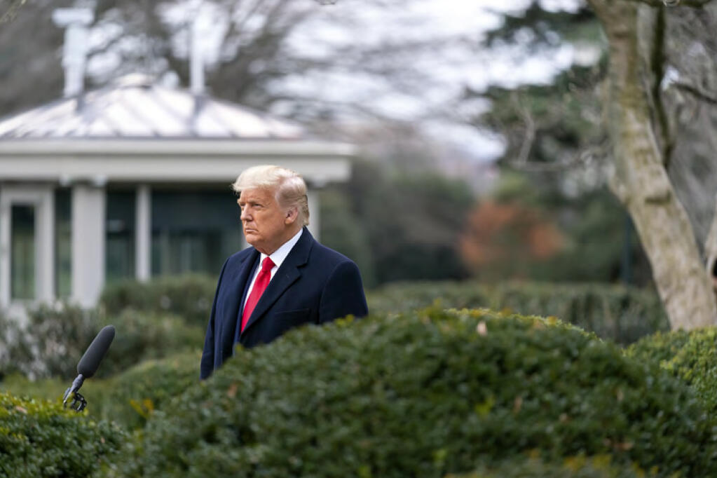 This image released in the final report by the House select committee investigating the Jan. 6 attack on the U.S. Capitol, on Thursday, Dec. 22, 2022, shows President Donald Trump recording a video statement on the afternoon of Jan. 6, 2021, from the Rose Garden of the White House in Washington. (House Select Committee via AP)