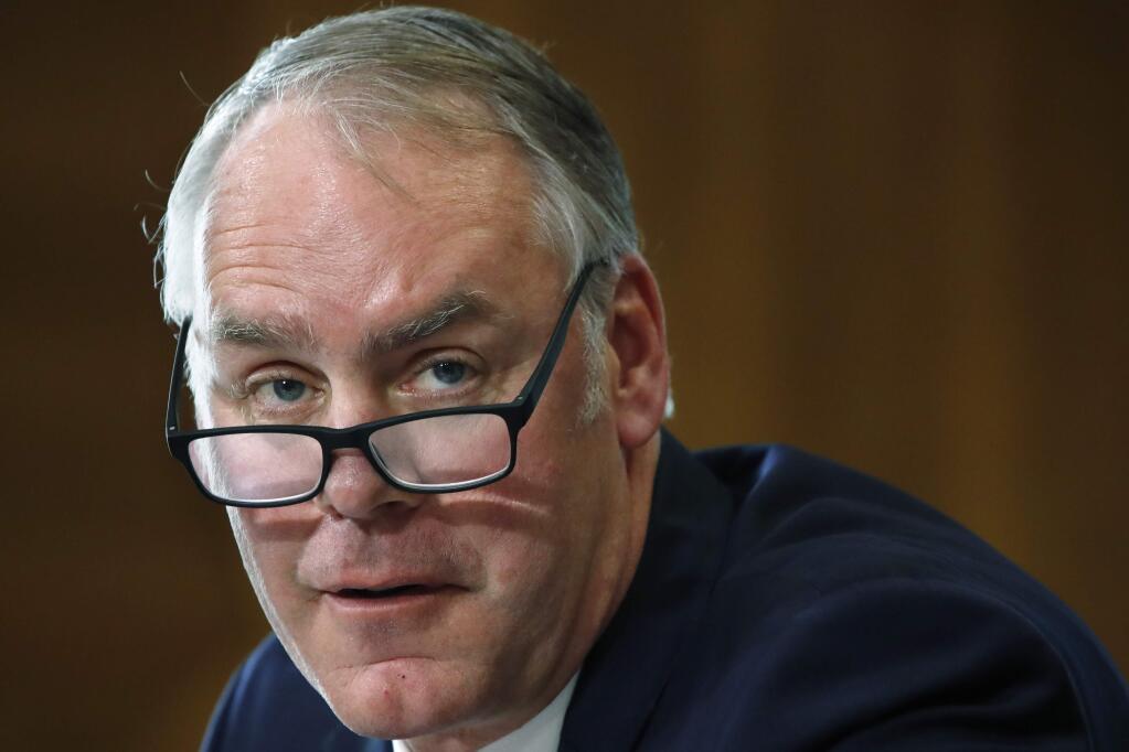 FILE - In this file photo from March 13, 2018, Interior Secretary Ryan Zinke testifies before the Senate Committee on Energy and Natural Resources on Capitol Hill in Washington. Zinke is drawing criticism for his use of a Japanese greeting when responding to a question from a congresswoman of Japanese descent during a hearing on March 15, 2018.( File AP Photo/Jacquelyn Martin)